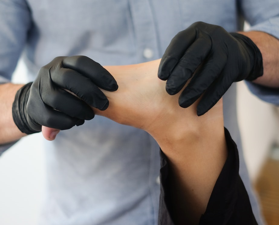 Physical therapist working on client's foot