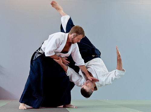 Aikido instructor demonstrating a takedown move