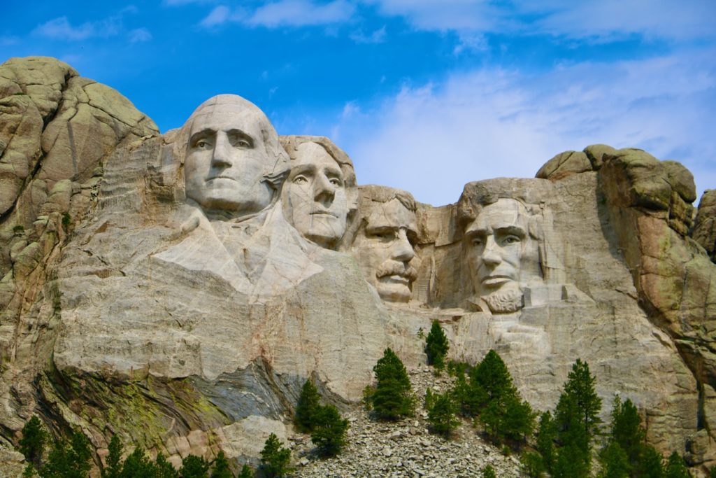 Mount Rushmore with a blue sky over top