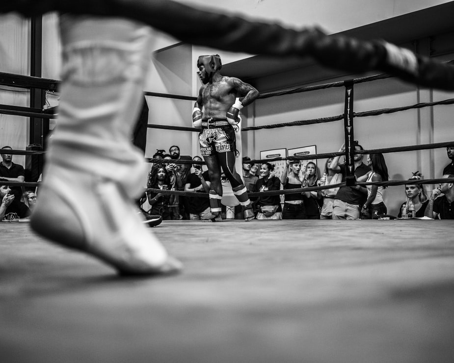 Fans cheering during a kickboxing competition