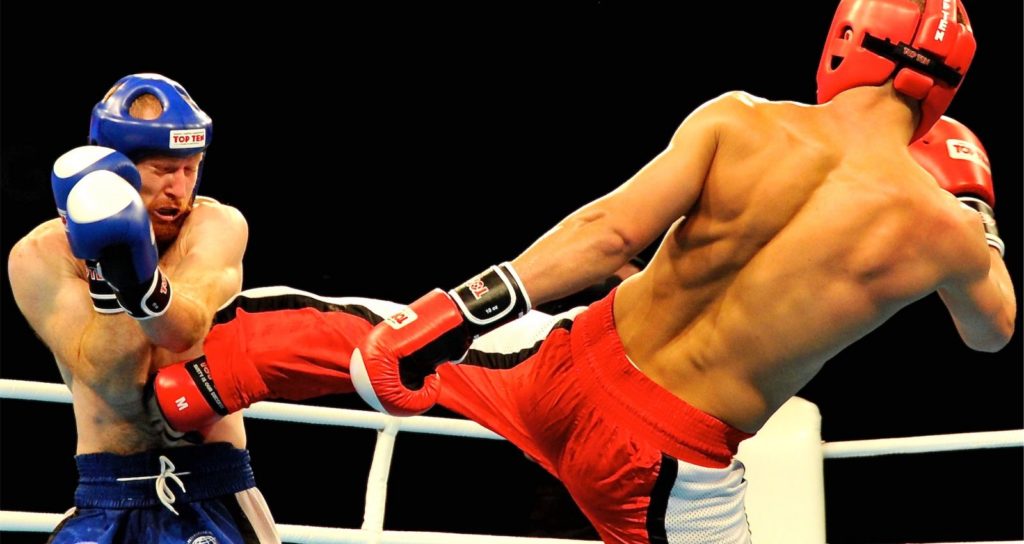 Kickboxers fighting in a ring